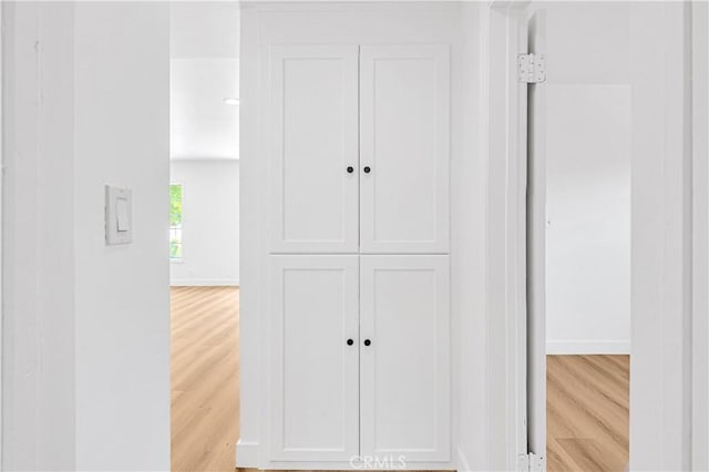 20328 Roscoe Blvd, Winnetka, CA 91306 - corridor featuring light wood-style floors and baseboards