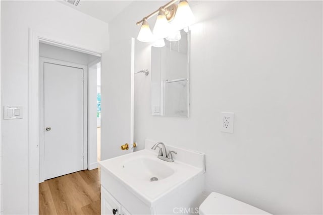 20328 Roscoe Blvd, Winnetka, CA 91306 - half bath featuring vanity and wood finished floors