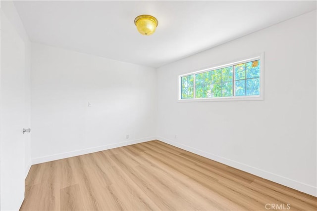 20328 Roscoe Blvd, Winnetka, CA 91306 - empty room featuring light wood finished floors and baseboards