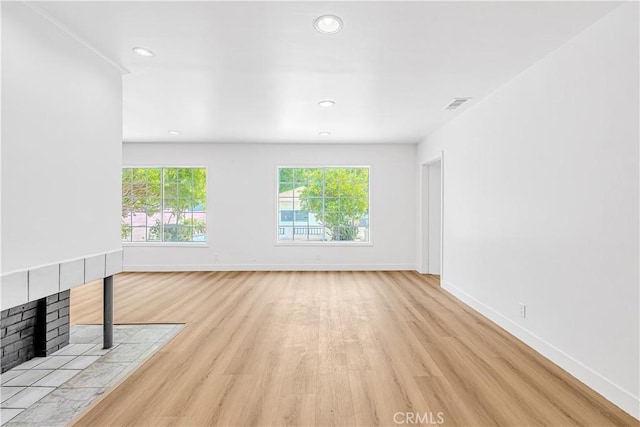 20328 Roscoe Blvd, Winnetka, CA 91306 - unfurnished living room featuring light wood-style floors and recessed lighting
