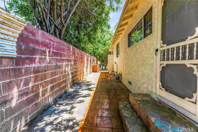 20328 Roscoe Blvd, Winnetka, CA 91306 - view of side of property featuring stucco siding and crawl space