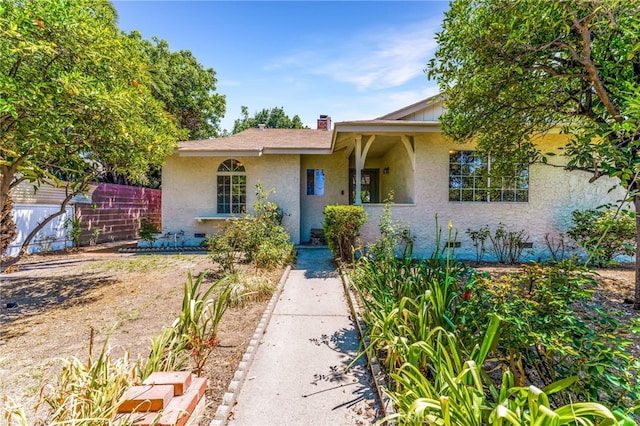 20328 Roscoe Blvd, Winnetka, CA 91306 - ranch-style house with stucco siding and a chimney