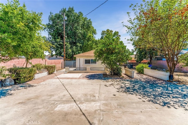 20328 Roscoe Blvd, Winnetka, CA 91306 - back of property featuring stucco siding and a patio area