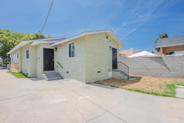 6622 5th Ave, Los Angeles, CA 90043 - rear view of house featuring crawl space, stucco siding, and a patio area