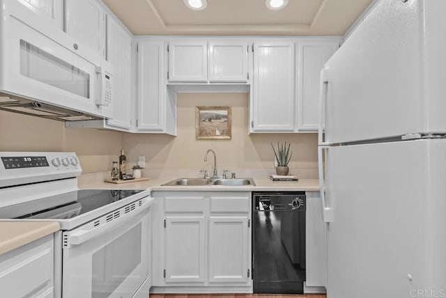 1682 Circa Del Lago Unit A306, San Marcos, CA 92078 - kitchen featuring white appliances, recessed lighting, white cabinetry, and a tray ceiling