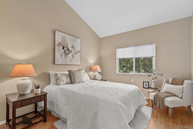 1682 Circa Del Lago Unit A306, San Marcos, CA 92078 - bedroom with wood finished floors and lofted ceiling
