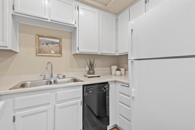 1682 Circa Del Lago Unit A306, San Marcos, CA 92078 - kitchen with freestanding refrigerator, black dishwasher, white cabinets, and light countertops