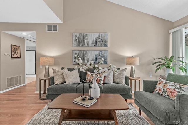 1682 Circa Del Lago Unit A306, San Marcos, CA 92078 - living area featuring wood finished floors and lofted ceiling