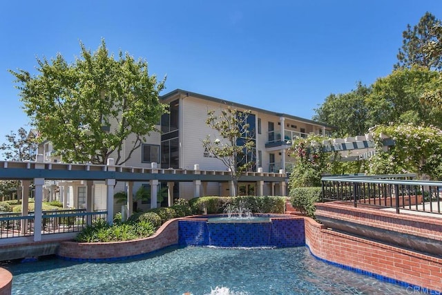 1682 Circa Del Lago Unit A306, San Marcos, CA 92078 - view of swimming pool featuring a pool with connected hot tub