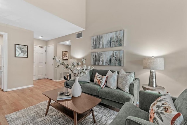 1682 Circa Del Lago Unit A306, San Marcos, CA 92078 - living area featuring light wood-style flooring and baseboards