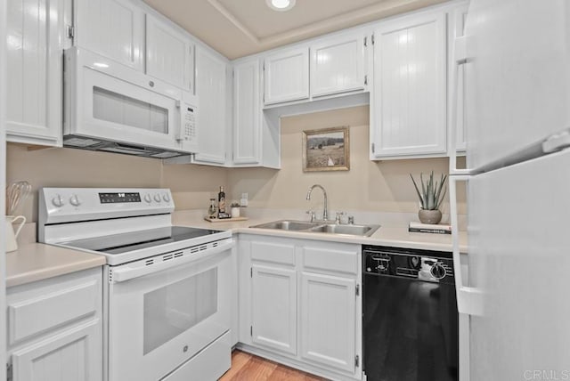 1682 Circa Del Lago Unit A306, San Marcos, CA 92078 - kitchen featuring white appliances, white cabinetry, light countertops, light wood-style flooring, and recessed lighting