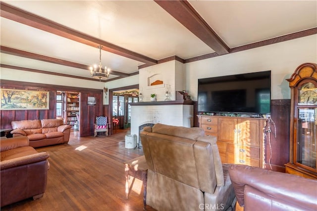 7914 Magnolia Ave, Riverside, CA 92504 - living room featuring beamed ceiling, a chandelier, and wood finished floors