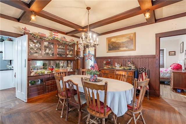 7914 Magnolia Ave, Riverside, CA 92504 - dining room with coffered ceiling, a wainscoted wall, a chandelier, and beam ceiling