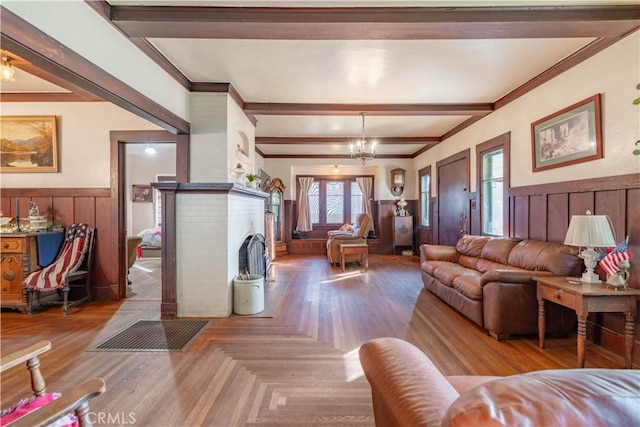 7914 Magnolia Ave, Riverside, CA 92504 - living area with a wainscoted wall, healthy amount of natural light, beam ceiling, a brick fireplace, and crown molding
