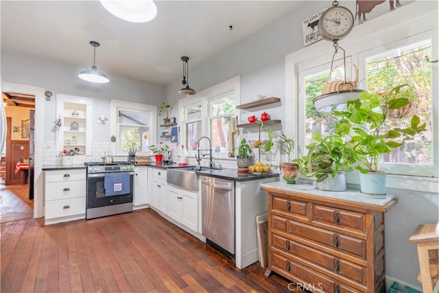 7914 Magnolia Ave, Riverside, CA 92504 - kitchen with stainless steel appliances, open shelves, white cabinets, and dark wood-type flooring