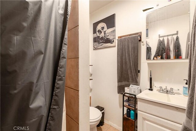 7914 Magnolia Ave, Riverside, CA 92504 - full bath featuring vanity, tile patterned flooring, and a shower with curtain