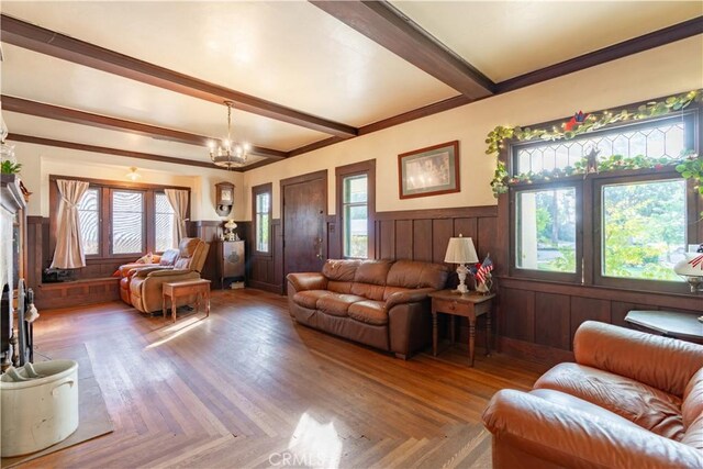 7914 Magnolia Ave, Riverside, CA 92504 - living room featuring a chandelier, wainscoting, and beam ceiling