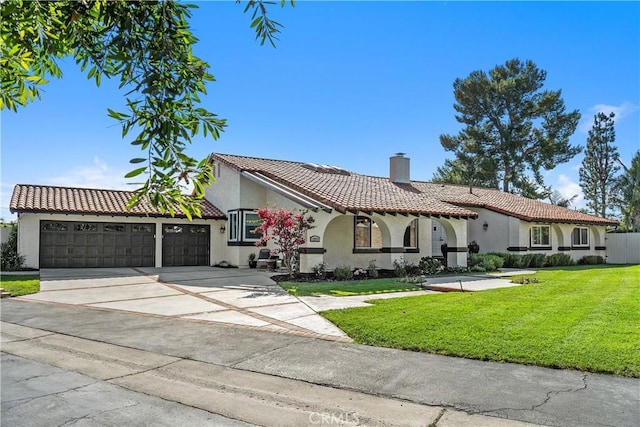 12571 Welbe Dr, North Tustin, CA 92705 - mediterranean / spanish house with a chimney, stucco siding, a front yard, and a garage
