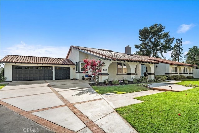 12571 Welbe Dr, North Tustin, CA 92705 - mediterranean / spanish house featuring a chimney, stucco siding, and driveway