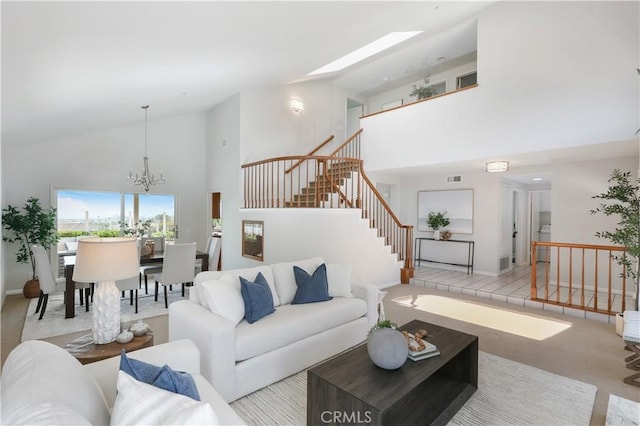 2245 Avenida Oliva, San Clemente, CA 92673 - carpeted living room featuring high vaulted ceiling, stairway, and a chandelier