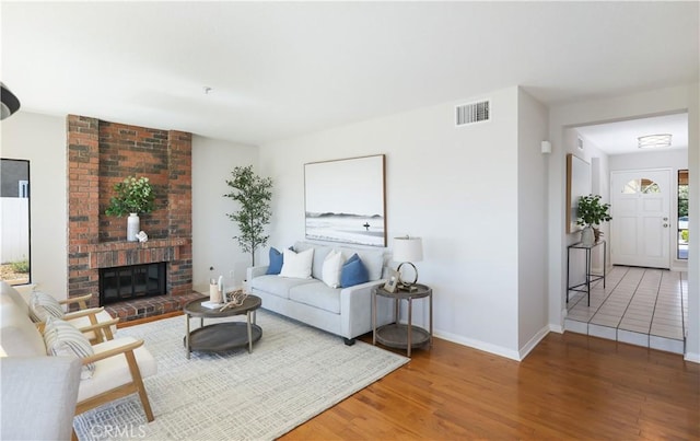 2245 Avenida Oliva, San Clemente, CA 92673 - living area with wood finished floors and a brick fireplace