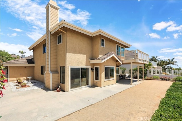 2245 Avenida Oliva, San Clemente, CA 92673 - back of house featuring a patio, a chimney, and stucco siding