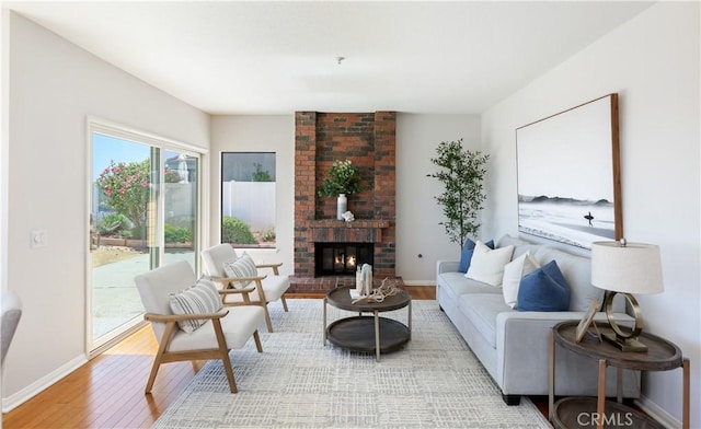 2245 Avenida Oliva, San Clemente, CA 92673 - living room with light wood-style flooring and a fireplace