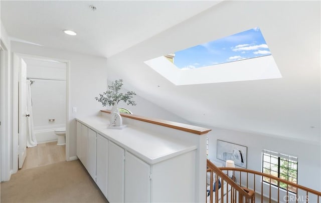 2245 Avenida Oliva, San Clemente, CA 92673 - hall featuring a skylight, an upstairs landing, light carpet, and recessed lighting