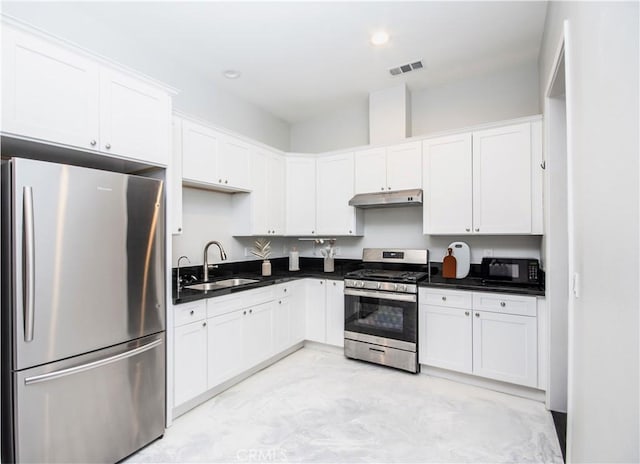 1204 Arbenz Cir, Corona, CA 92881 - kitchen with appliances with stainless steel finishes, under cabinet range hood, white cabinets, dark countertops, and recessed lighting