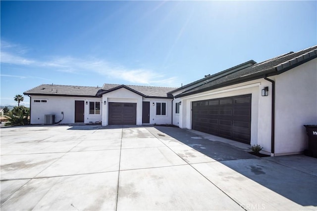 1204 Arbenz Cir, Corona, CA 92881 - view of front facade with stucco siding, an attached garage, and concrete driveway