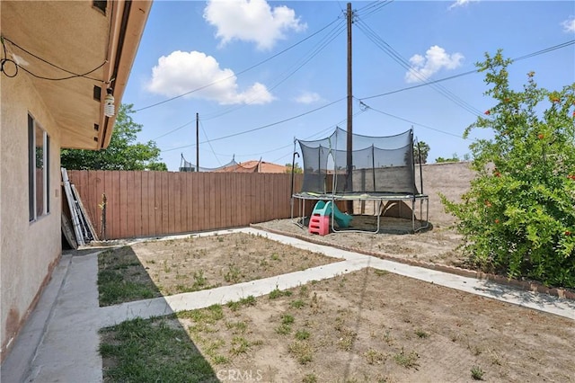 260 E Whittier Ave, Hemet, CA 92543 - fenced backyard featuring a trampoline