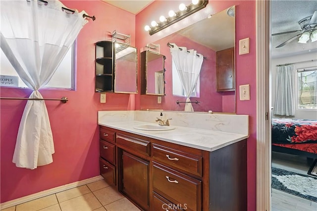 260 E Whittier Ave, Hemet, CA 92543 - ensuite bathroom with vanity, tile patterned flooring, and ceiling fan