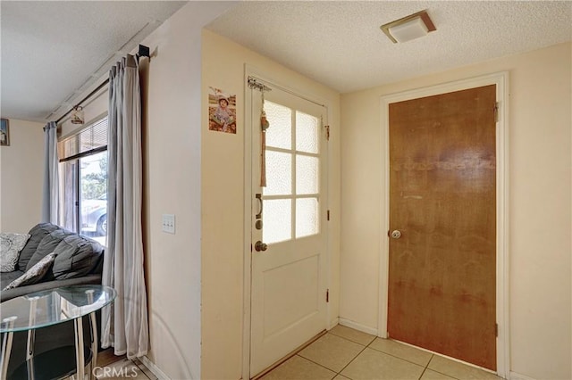 260 E Whittier Ave, Hemet, CA 92543 - foyer entrance featuring a textured ceiling and light tile patterned flooring