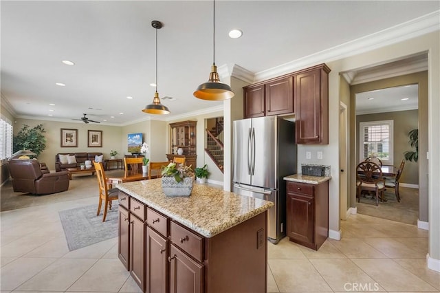 33976 Galleron St, Temecula, CA 92592 - kitchen with freestanding refrigerator, healthy amount of natural light, recessed lighting, light tile patterned floors, and ceiling fan