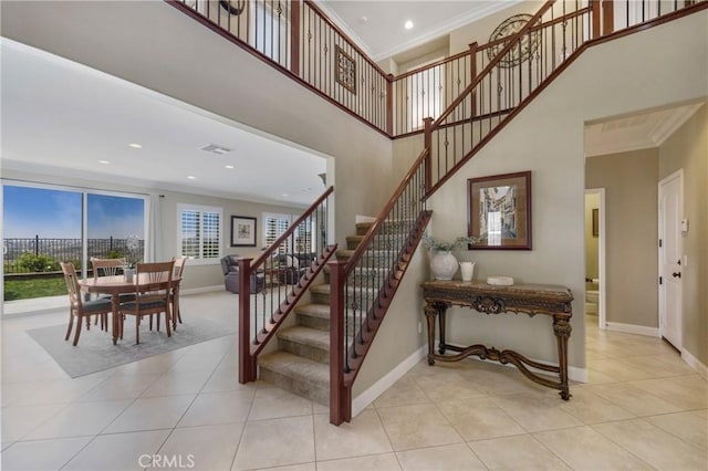 33976 Galleron St, Temecula, CA 92592 - stairs with crown molding, tile patterned floors, a towering ceiling, and recessed lighting