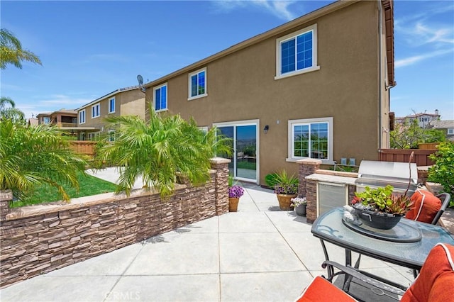 33976 Galleron St, Temecula, CA 92592 - rear view of house with a patio, an outdoor kitchen, and stucco siding