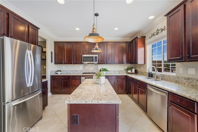 33976 Galleron St, Temecula, CA 92592 - kitchen featuring stainless steel appliances, a kitchen island, light tile patterned floors, light stone counters, and crown molding