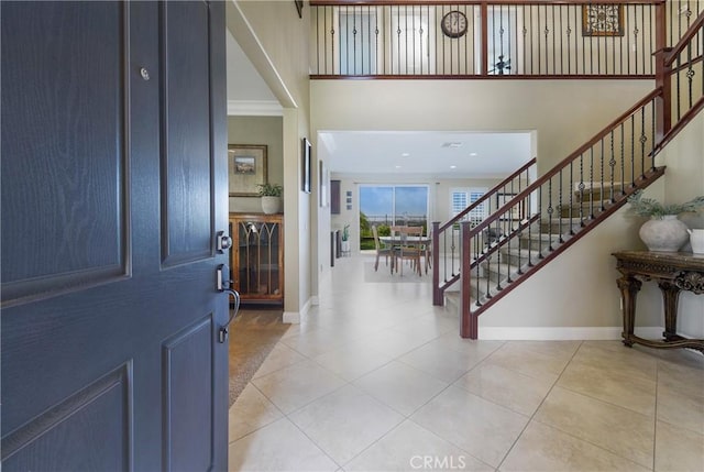 33976 Galleron St, Temecula, CA 92592 - entryway featuring stairway, tile patterned floors, and a high ceiling