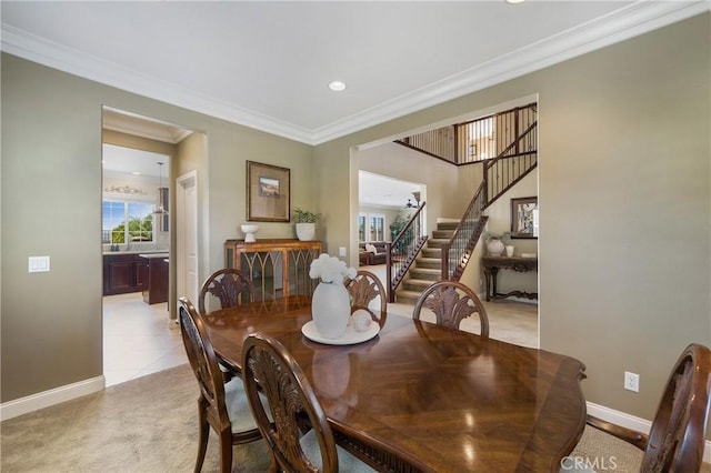 33976 Galleron St, Temecula, CA 92592 - dining room featuring stairway, ornamental molding, light colored carpet, and recessed lighting