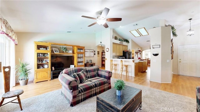 7075 Montana Ave, Fontana, CA 92336 - living room featuring light wood-style floors, a ceiling fan, and high vaulted ceiling