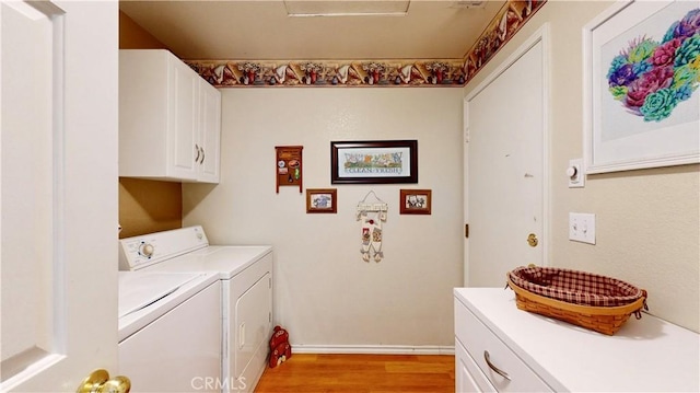 7075 Montana Ave, Fontana, CA 92336 - washroom with cabinet space, independent washer and dryer, and light wood finished floors