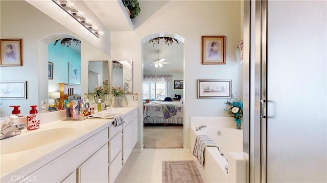 7075 Montana Ave, Fontana, CA 92336 - ensuite bathroom featuring a ceiling fan, double vanity, a bath, and a shower with shower door