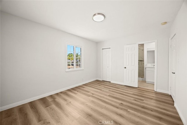 181 W Casad St, Covina, CA 91723 - unfurnished bedroom with light wood-style flooring, ensuite bathroom, and a closet