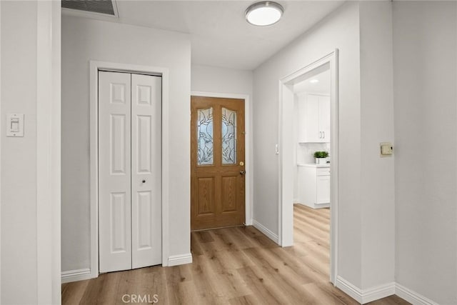 181 W Casad St, Covina, CA 91723 - foyer entrance with light wood-style floors and baseboards
