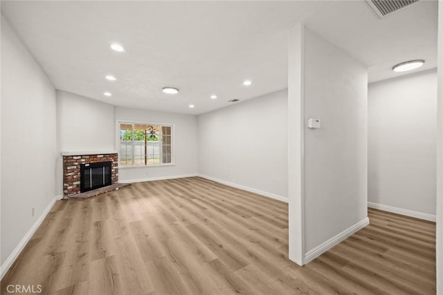 181 W Casad St, Covina, CA 91723 - unfurnished living room featuring light wood-type flooring, recessed lighting, and a fireplace