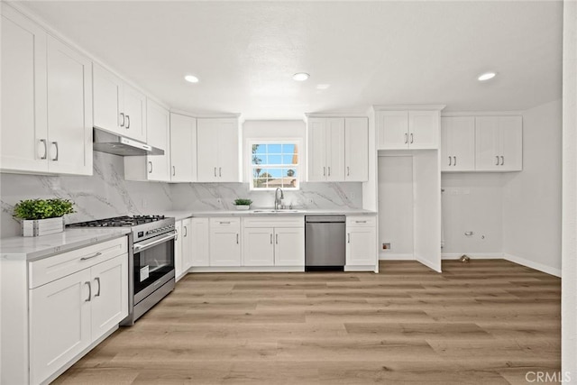 181 W Casad St, Covina, CA 91723 - kitchen featuring stainless steel appliances, under cabinet range hood, backsplash, white cabinetry, and recessed lighting