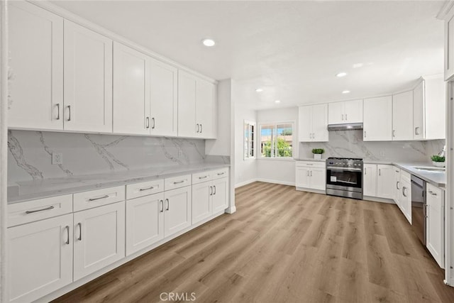 181 W Casad St, Covina, CA 91723 - kitchen with appliances with stainless steel finishes, recessed lighting, white cabinetry, tasteful backsplash, and light wood finished floors