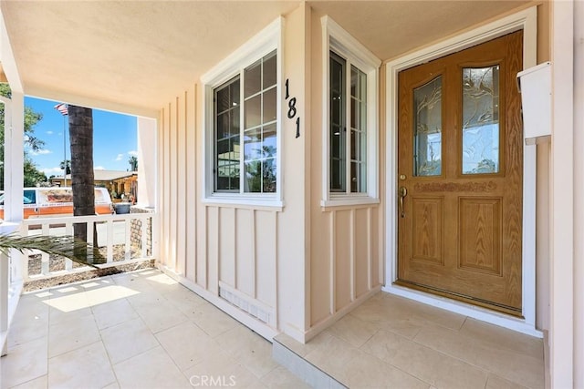 181 W Casad St, Covina, CA 91723 - doorway to property featuring a porch and board and batten siding