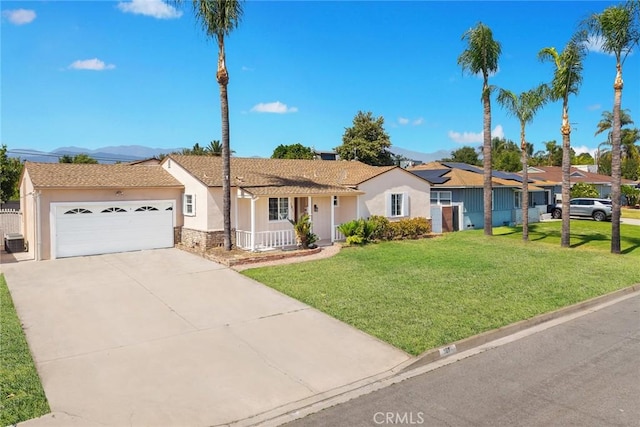 181 W Casad St, Covina, CA 91723 - ranch-style home with stucco siding, a front lawn, an attached garage, a mountain view, and concrete driveway