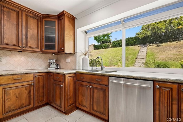 20681 Via Amarilla, Yorba Linda, CA 92886 - kitchen featuring stainless steel dishwasher, light tile patterned floors, decorative backsplash, light stone countertops, and crown molding